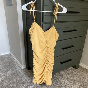 Beautiful yellow ruched mini dress